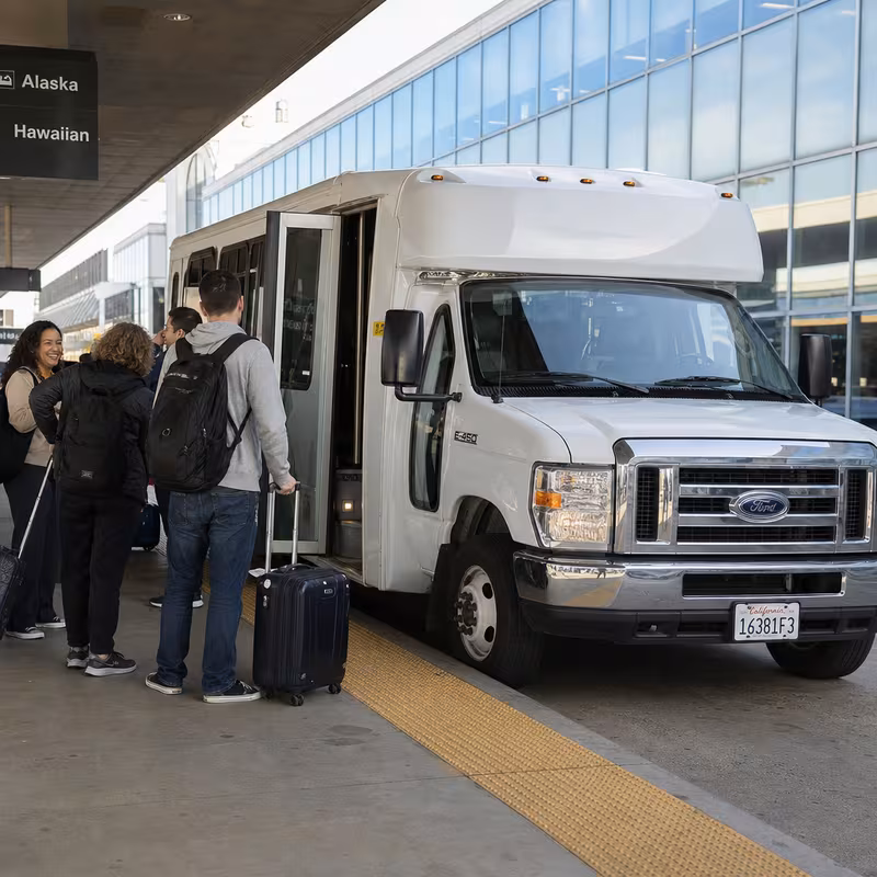 Black Mercedes Sprinter van staged for an Oakland Airport Transportation group