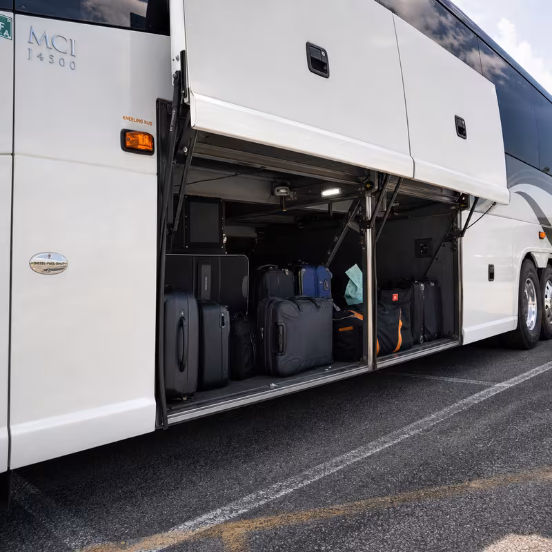 Party bus interior with wraparound leather seating and LED lighting in Oakland
