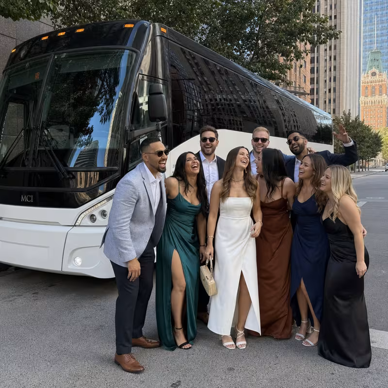 Passengers loading luggage while boarding an Oakland group shuttle