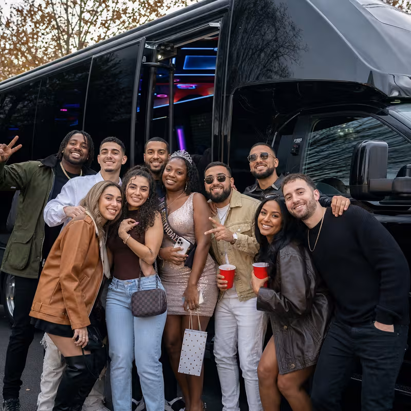 Party bus interior with wraparound leather seating and LED lighting in Oakland
