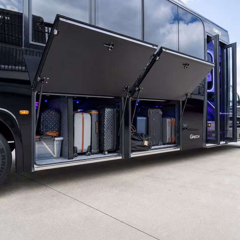 Party bus interior with wraparound leather seating and LED lighting in Oakland
