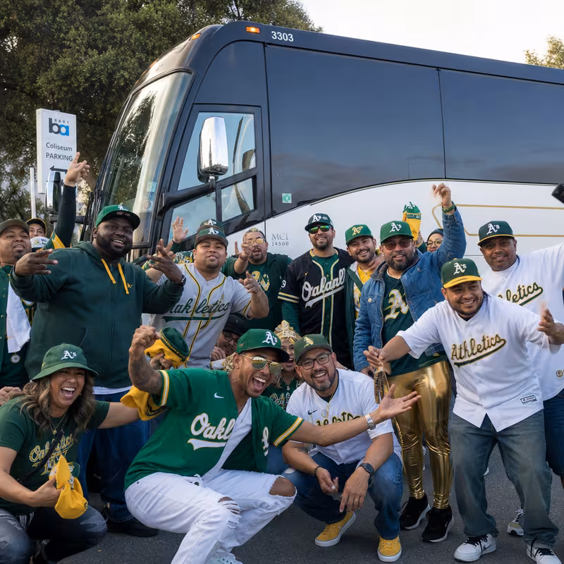 Passengers loading luggage while boarding an Oakland group shuttle