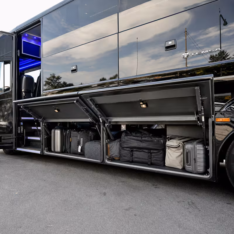 Party bus interior with wraparound leather seating and LED lighting in Oakland