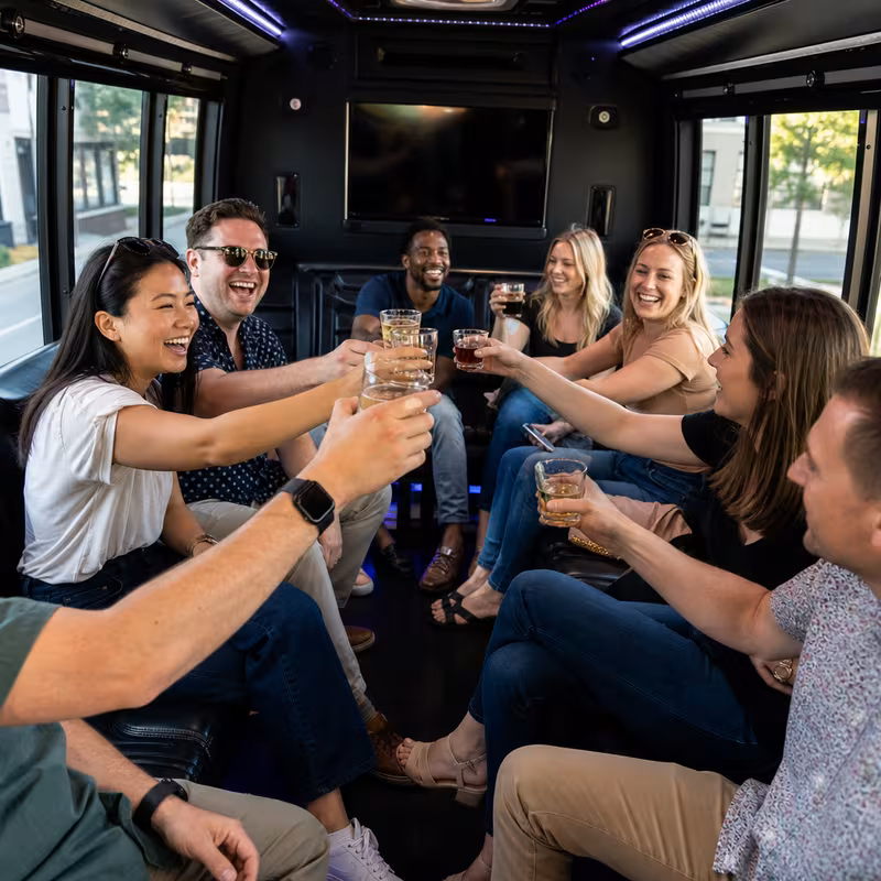 Group boarding a white charter bus for Winery & Brewery Tour Transportation transportation in Oakland