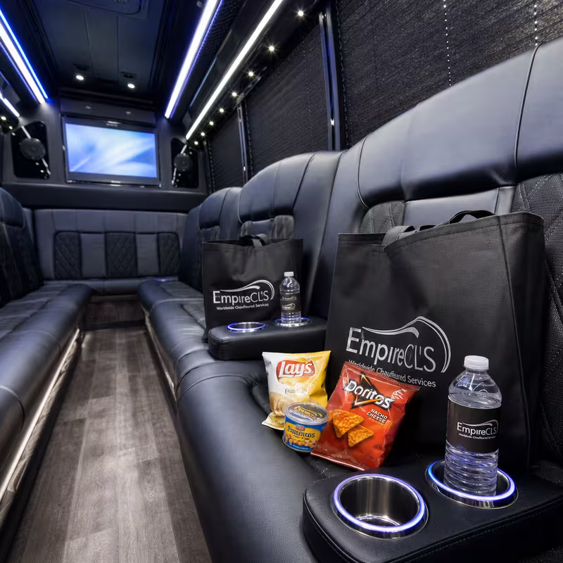 Party bus interior with wraparound leather seating and LED lighting in Oakland