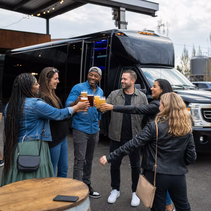 Passengers loading luggage while boarding an Oakland group shuttle